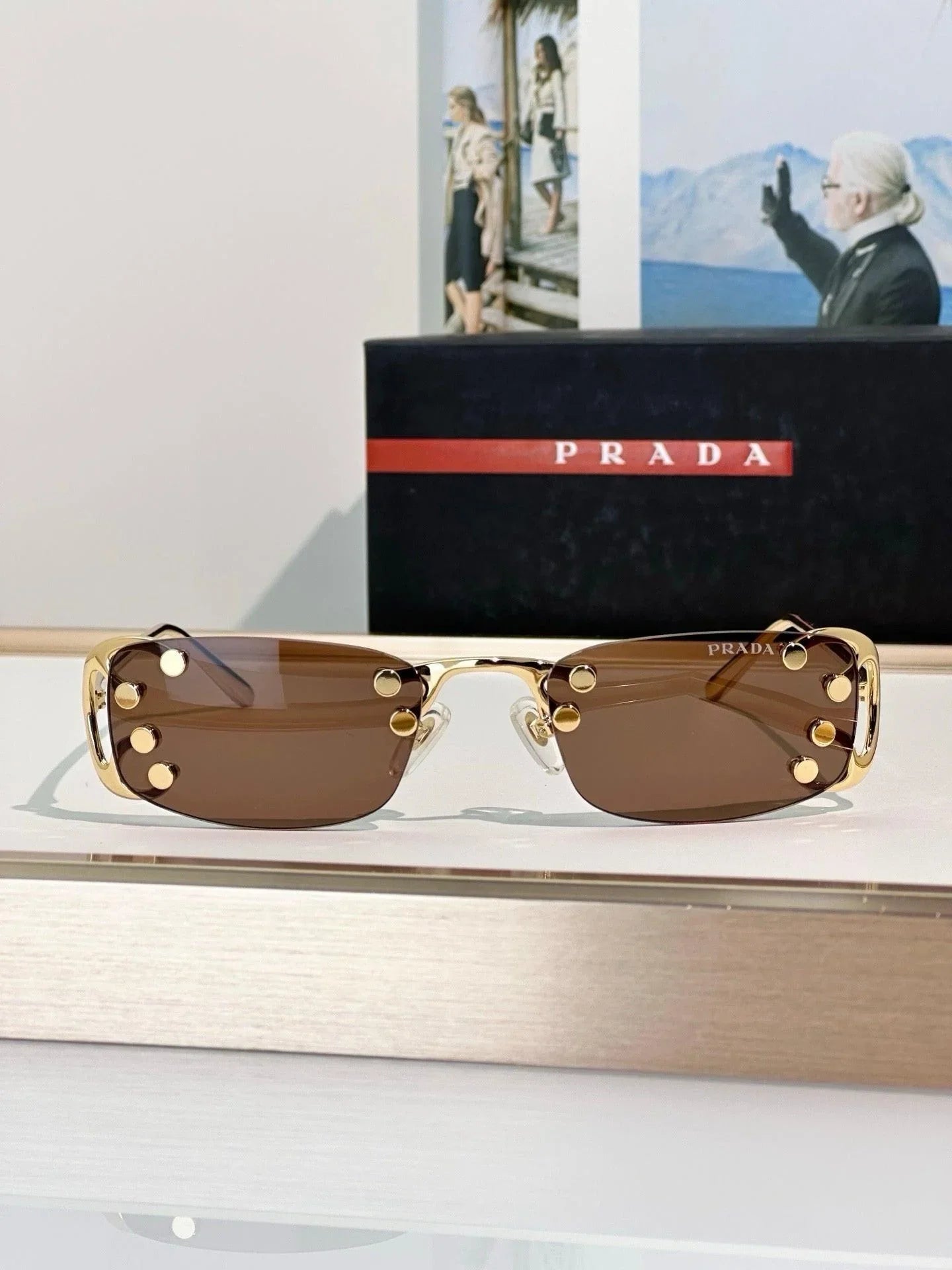 Prada sunglasses with a translucent speckled tan design Camomile Lenses Prada Sunglasses With The Iconic Metal  main image 3