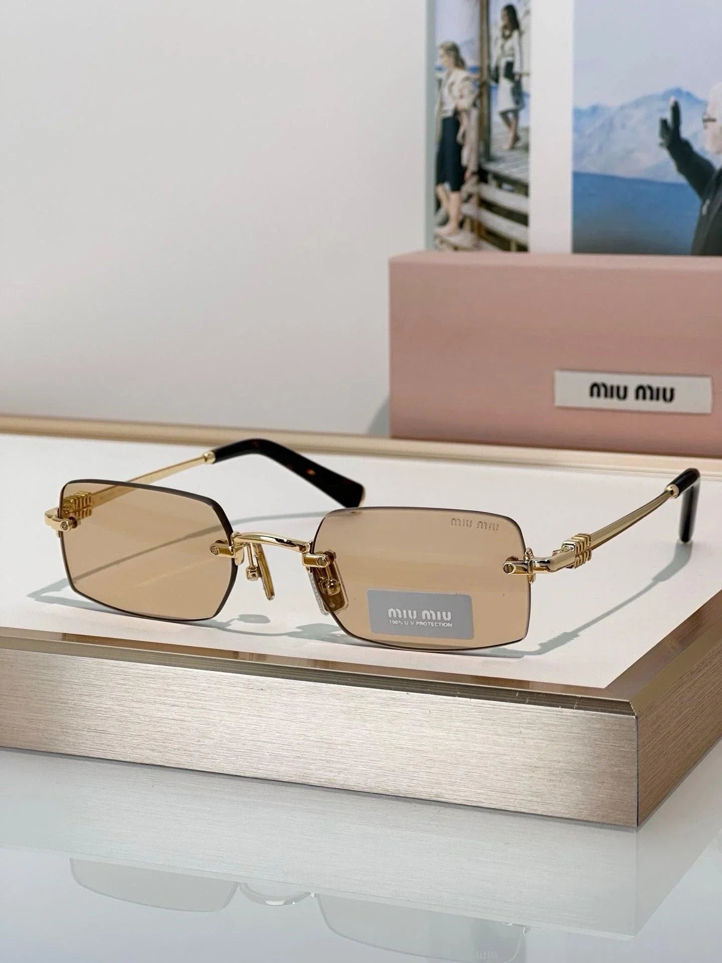 Miu Miu MUB50S 26C09Z Sunglasses Gold Rectangle Frame, Brown Lenses Miu Miu MUB50S Sunglasses 26C09Z Old Gold - eye-oo.com main image 3