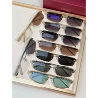 Cartier CT0544S 002 Gold Grey Rectangular Photochromic Unisex Sunglasses 🐆
